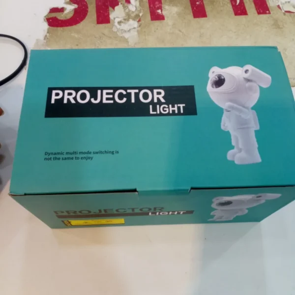 Teal Projector Light box with an astronaut figure on the side