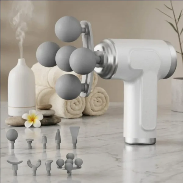 White LM-280 handheld massage gun with interchangeable heads laid out beside it