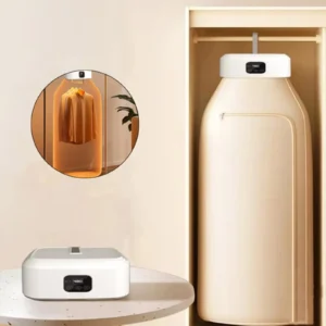 Portable electric clothes dryer machine with hanging drying bag set up in a wardrobe