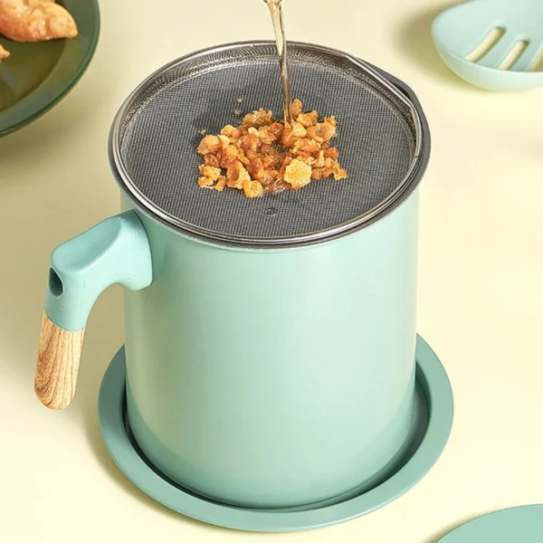 Mesh filter on top of the pot holding fried food crumbs