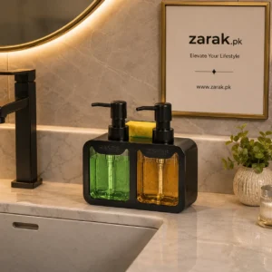 Black double soap dispenser caddy with green and amber liquid beside a sink