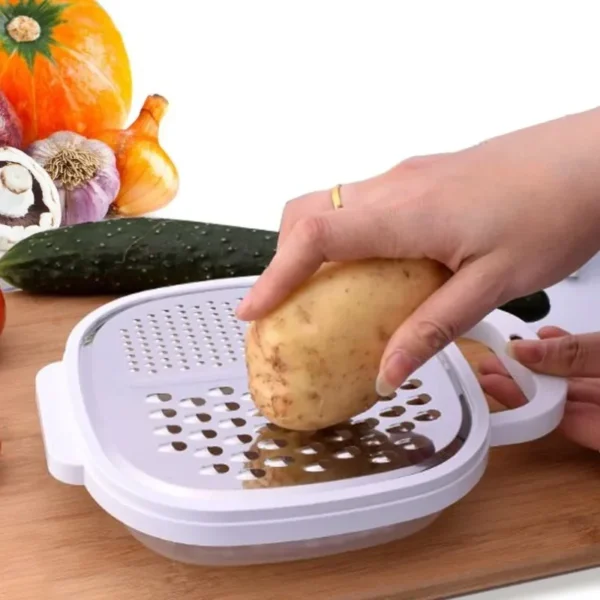 Grating a potato on the 4-in-1 vegetable grater set over the storage tray