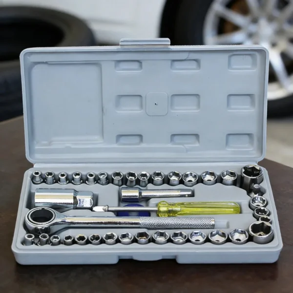 Open grey case with sockets, ratchet handle, extension and a yellow-handled tool