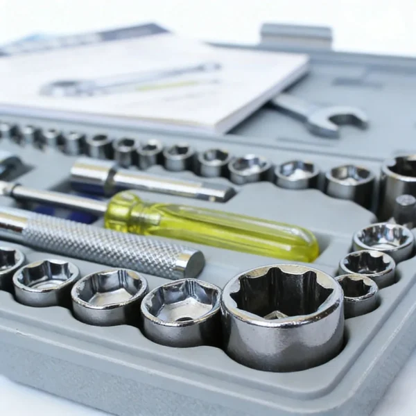 Close-up of large sockets, an extension bar and a yellow-handled tool with the case
