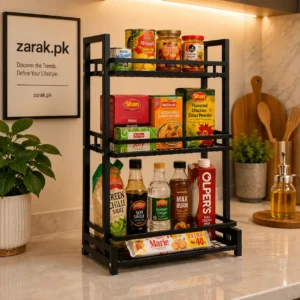 3-tier black countertop rack holding packaged food and bottles in a kitchen