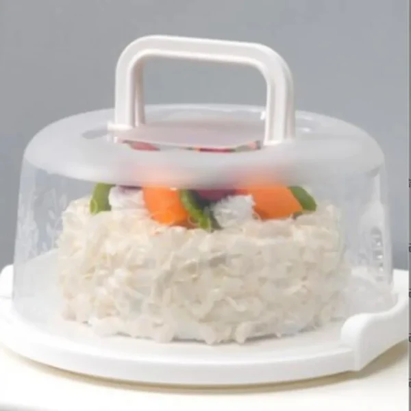 Close-up of a cake inside the clear dome carrier with white base and handle