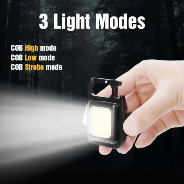 Hand holding the mini LED flashlight keychain, with text listing three light modes: high, low and strobe