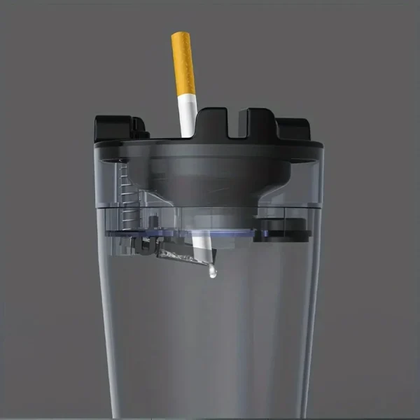 Side view of the clear lower section of the ashtray with water inside and a cigarette on top