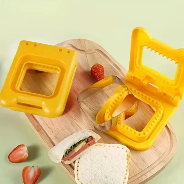 Yellow square sandwich cutter and sealer with a sealed ham and lettuce pocket sandwich