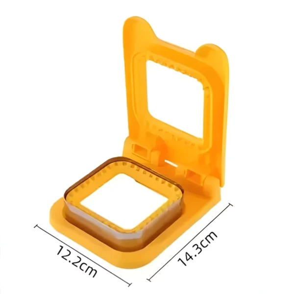 Yellow square sandwich cutter and sealer marked 12.2 cm by 14.3 cm