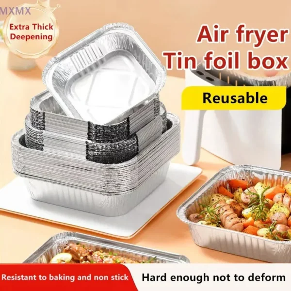 Stack of square foil boxes in several sizes with food on a table