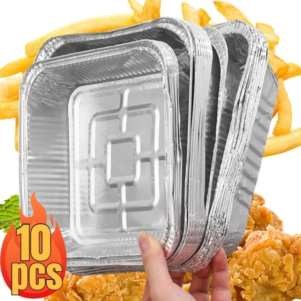 Pack of 10 square aluminium foil disposable plates held in hand with fried food in the background