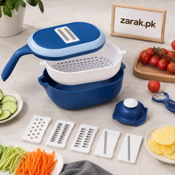 Blue and white vegetable cutter with basket, five blades and sliced vegetables on a kitchen counter