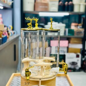 3-in-1 revolving beverage dispenser with gold taps on a wooden stand