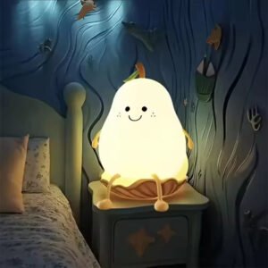 Cute pear-shaped touch-sensor night light glowing on a bedside table
