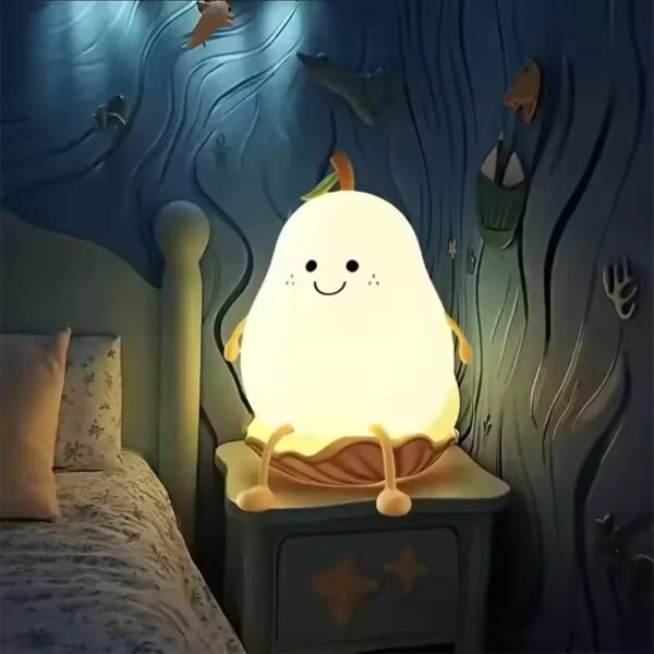 Cute pear-shaped touch-sensor night light glowing on a bedside table