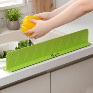 Silicone sink splash guard with suction mounted on a kitchen sink